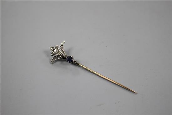 An early 20th century yellow and white metal, sapphire and diamond set stick pin, 62mm, gross weight 2.4 grams.